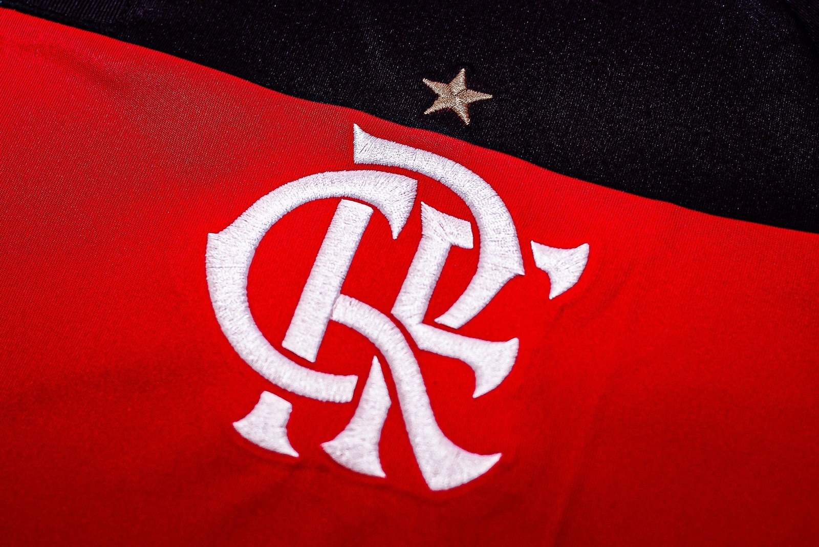Close-up of the Flamengo crest on a red and black shirt